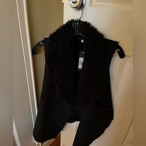 Black fur on the inside vest
